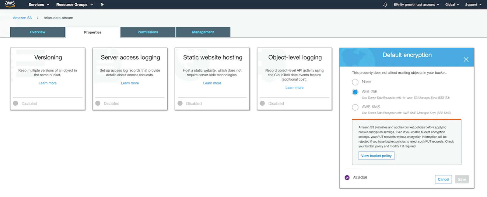 The same test S3 bucket. The 'Properties' tab is active, showing various available properties and their status. All are disabled except 'Default encryption,' which has 'AES-256' as the selected value. A modal is visible, prompting you to 'View bucket policy.'