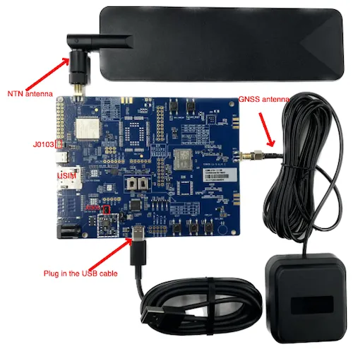 Evaluation board with labeled NTN antenna, GNSS antenna, USIM slot, and USB cable connection